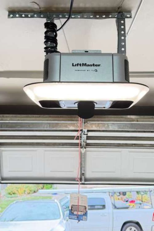 Expert Technician Installing Garage Door